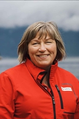 Anita Hjønnevåg. Kvinne smiler til kamera.