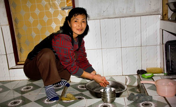 50 year old Kim Ok Sik benefitted from a project where the Red Cross installed water in her house, Sinyang county (Photo: Vivian Paulsen, NorCross). 