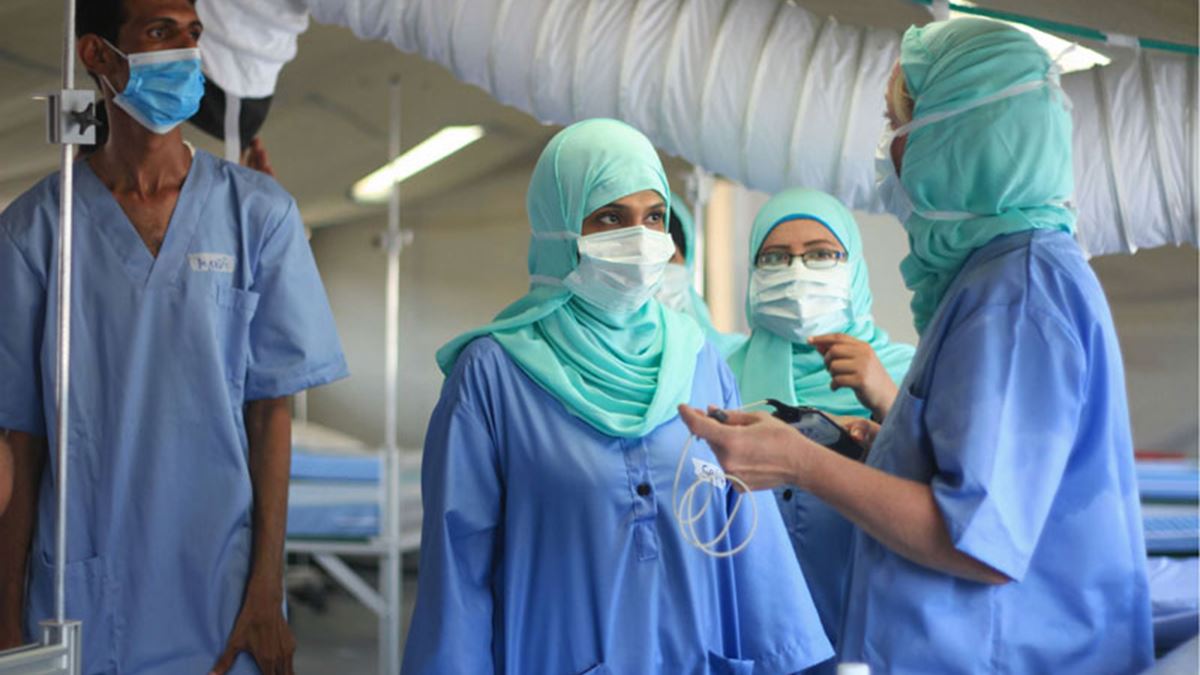 Medical staff dressed in blue