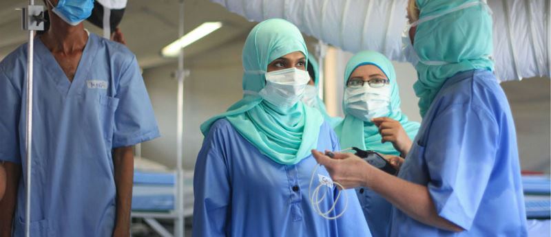 Medical staff dressed in blue
